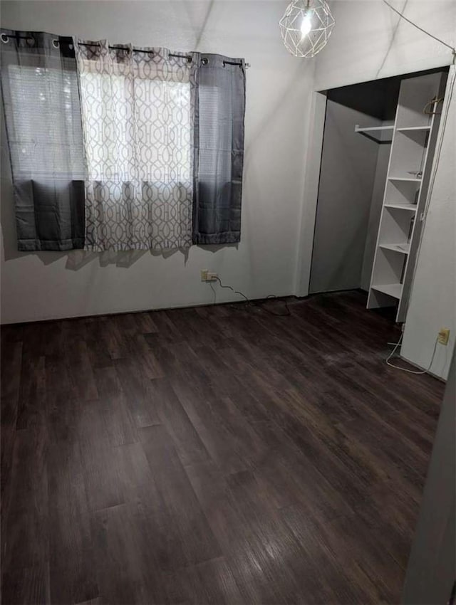 unfurnished bedroom featuring wood finished floors