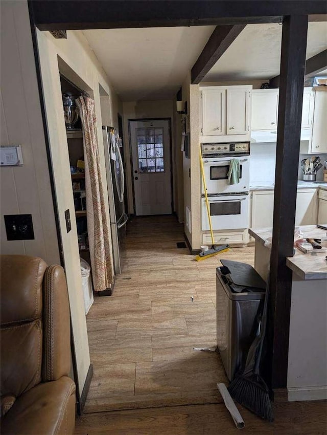 hall with light wood-style flooring
