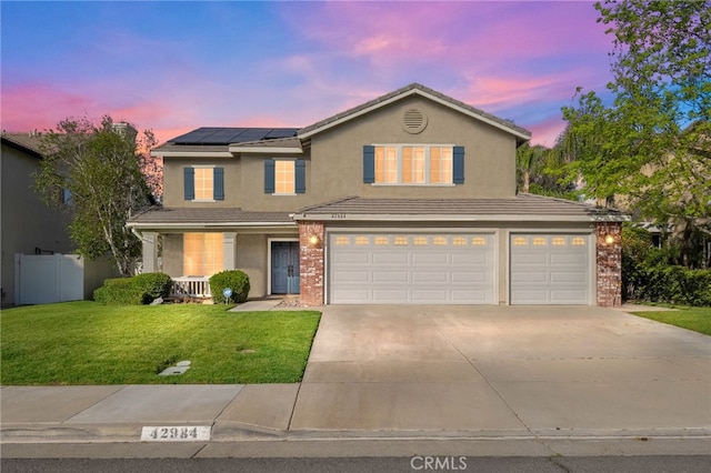 42984 Calle Reva, Temecula, CA 92592 - traditional home with a porch, a front yard, solar panels, a garage, and driveway