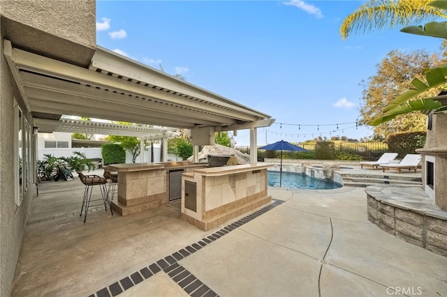 42984 Calle Reva, Temecula, CA 92592 - view of swimming pool with a patio area, a fenced backyard, outdoor dry bar, and an outdoor kitchen