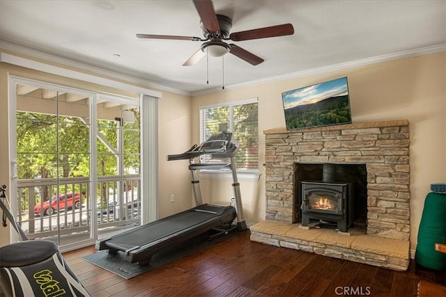 30964 Summit Dr, Running Springs, CA 92382 - workout room with a wood stove, hardwood / wood-style flooring, ornamental molding, and ceiling fan