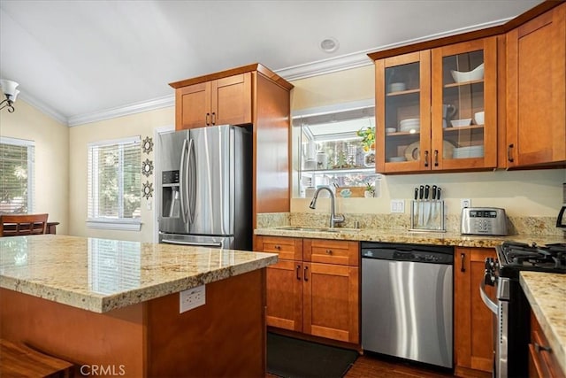 30964 Summit Dr, Running Springs, CA 92382 - kitchen with crown molding, light stone counters, a sink, stainless steel appliances, and brown cabinets