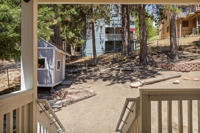 30964 Summit Dr, Running Springs, CA 92382 - view of yard featuring fence, an outbuilding, and a storage unit