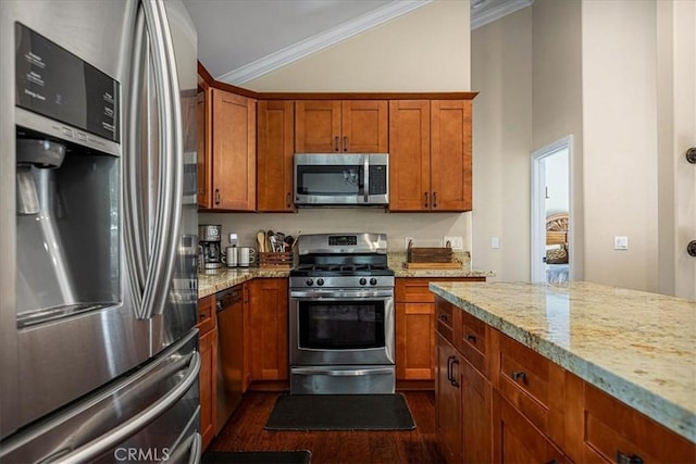 30964 Summit Dr, Running Springs, CA 92382 - kitchen with dark wood-style flooring, ornamental molding, appliances with stainless steel finishes, brown cabinetry, and light stone counters