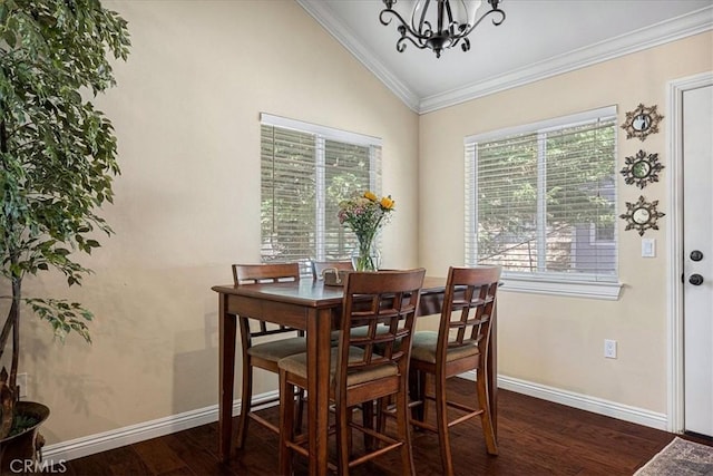 30964 Summit Dr, Running Springs, CA 92382 - dining space with crown molding, an inviting chandelier, vaulted ceiling, dark wood-style flooring, and baseboards