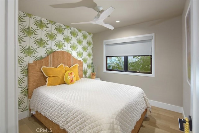 3601 Finley Ave, Newport Beach, CA 92663 - bedroom featuring baseboards, recessed lighting, a ceiling fan, an accent wall, and wood finished floors
