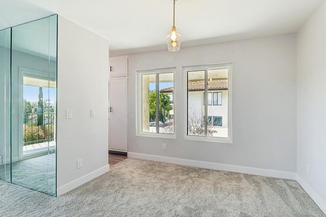17607 Pomerado Rd Unit 204, San Diego, CA 92128 - unfurnished room featuring baseboards, carpet floors, and a healthy amount of sunlight
