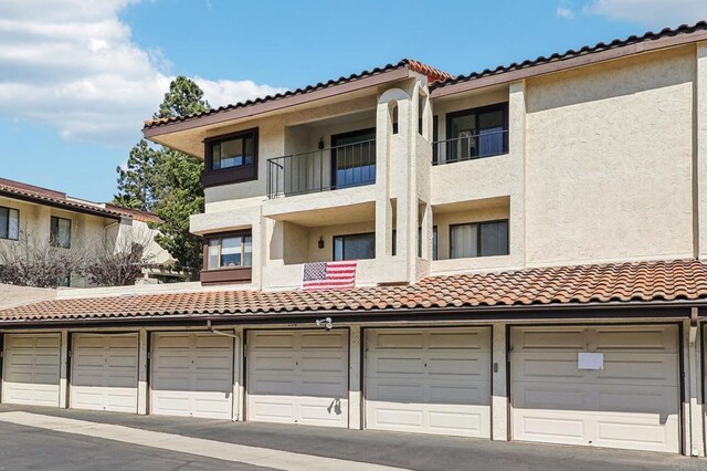 17607 Pomerado Rd Unit 204, San Diego, CA 92128 - view of building exterior with community garages