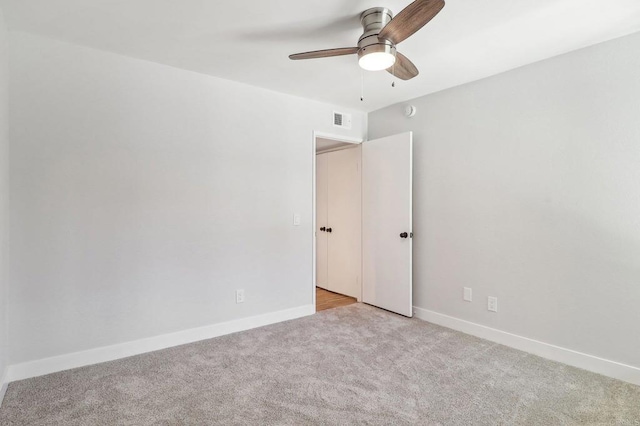 17607 Pomerado Rd Unit 204, San Diego, CA 92128 - spare room featuring baseboards, a ceiling fan, visible vents, and light colored carpet