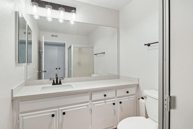 17607 Pomerado Rd Unit 204, San Diego, CA 92128 - bathroom featuring visible vents, toilet, vanity, and a stall shower