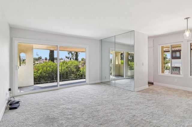 17607 Pomerado Rd Unit 204, San Diego, CA 92128 - unfurnished bedroom with multiple windows, carpet flooring, baseboards, and access to outside