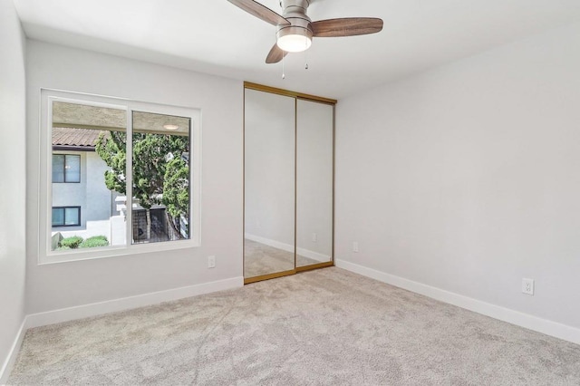 17607 Pomerado Rd Unit 204, San Diego, CA 92128 - unfurnished bedroom with carpet, a closet, a ceiling fan, and baseboards