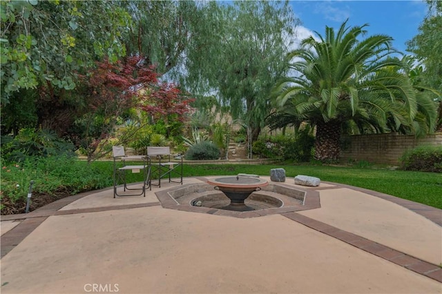 view of patio / terrace featuring fence