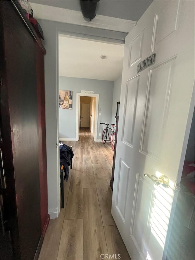 2245 W 27th Ave, Los Angeles, CA 90018 - corridor with baseboards and light wood-type flooring