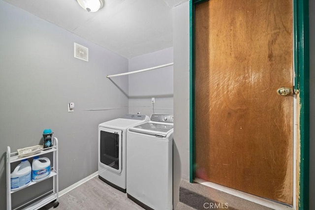 7531 Lookout Loop, Pine Valley, CA 91962 - laundry area with light wood-style flooring, baseboards, visible vents, washer and dryer, and laundry area
