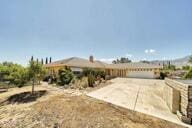 9975 Custer Ave, Lucerne Valley, CA 92356 - view of front of property with a garage and driveway