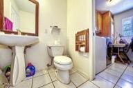 9975 Custer Ave, Lucerne Valley, CA 92356 - bathroom featuring tile patterned floors and toilet