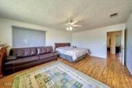 9975 Custer Ave, Lucerne Valley, CA 92356 - bedroom featuring visible vents and wood finished floors