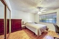 9975 Custer Ave, Lucerne Valley, CA 92356 - bedroom featuring a ceiling fan and wood finished floors