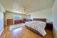 9975 Custer Ave, Lucerne Valley, CA 92356 - bedroom featuring wood finished floors