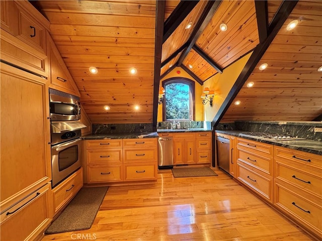 24250 Pacific Heights Dr, Westport, CA 95488 - kitchen featuring light wood-style flooring, a peninsula, wall oven, stainless steel microwave, and vaulted ceiling with beams