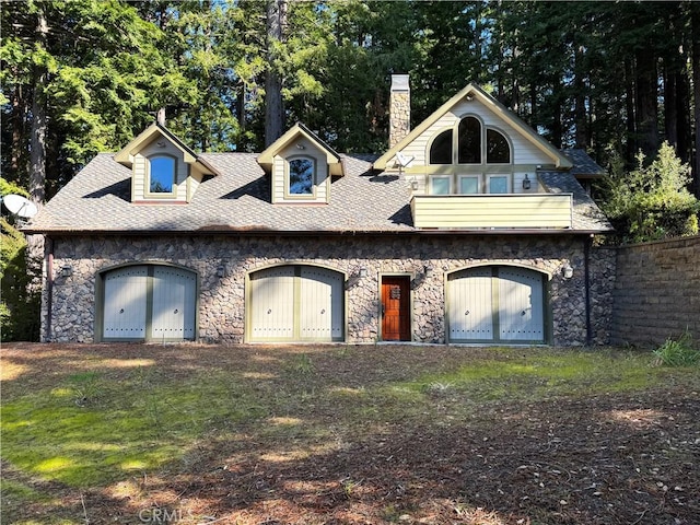 24250 Pacific Heights Dr, Westport, CA 95488 - view of front facade featuring fence, roof with shingles, stone siding, and a chimney