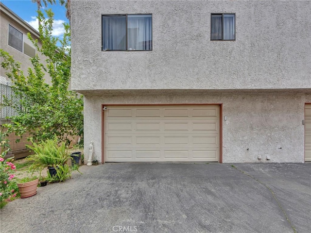 garage featuring driveway