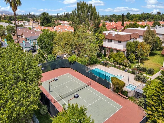 aerial view of residential area featuring a pool area