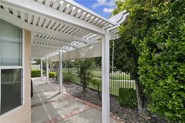 view of patio featuring a fenced backyard and a pergola