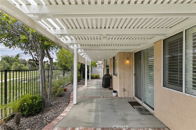 view of patio featuring a fenced backyard, a grill, and a pergola