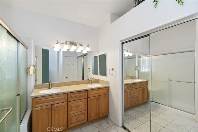 full bathroom featuring tile patterned flooring, double vanity, and a sink