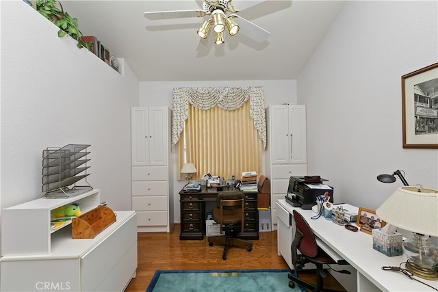 home office with ceiling fan and wood finished floors