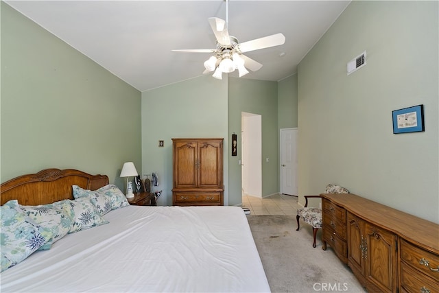 bedroom with visible vents, high vaulted ceiling, light carpet, and a ceiling fan