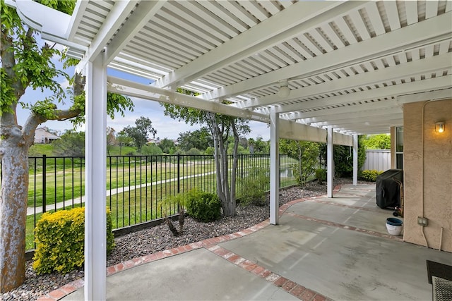 view of patio / terrace with a pergola and a fenced backyard