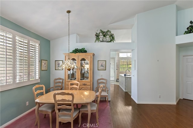 dining area featuring wood finished floors and baseboards