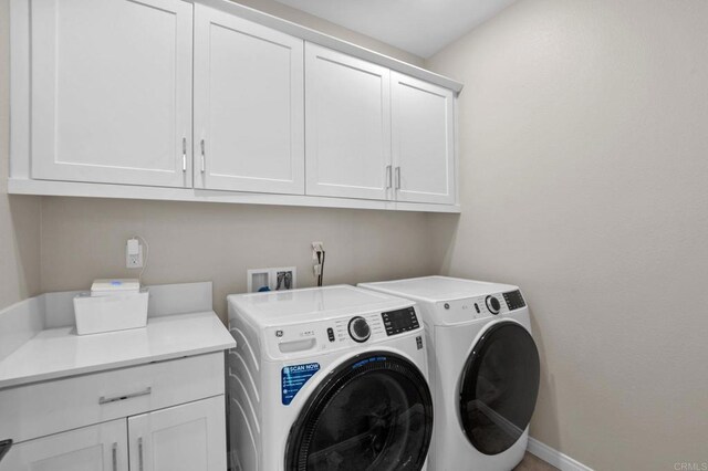 1751 Whitmore Loop, Chula Vista, CA 91913 - laundry room with washing machine and dryer, cabinet space, and baseboards