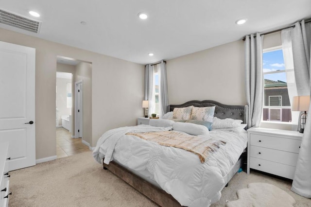 1751 Whitmore Loop, Chula Vista, CA 91913 - bedroom with light colored carpet, recessed lighting, baseboards, and connected bathroom