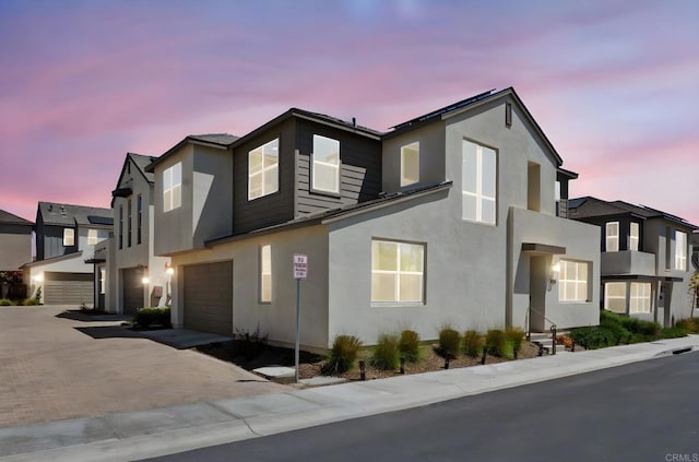 1751 Whitmore Loop, Chula Vista, CA 91913 - view of front of house with a garage, stucco siding, and driveway