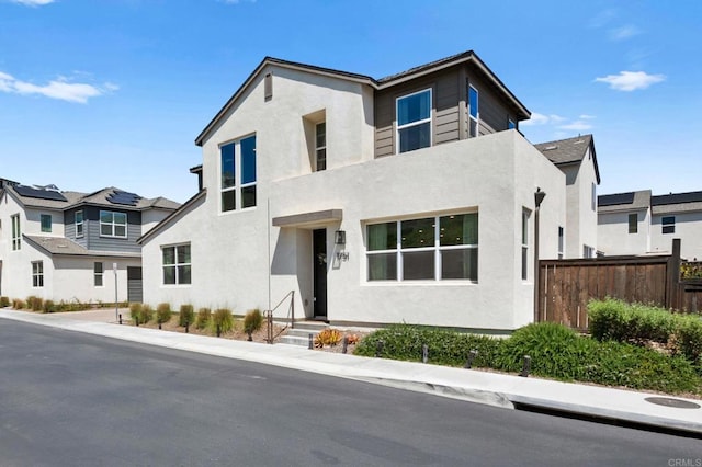 1751 Whitmore Loop, Chula Vista, CA 91913 - view of front of house featuring fence, stucco siding, and a residential view