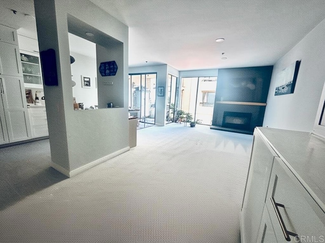 hallway featuring carpet flooring