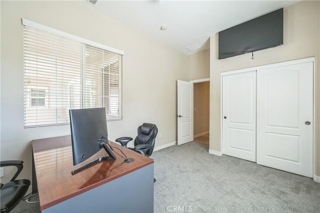 home office with carpet flooring, baseboards, and visible vents