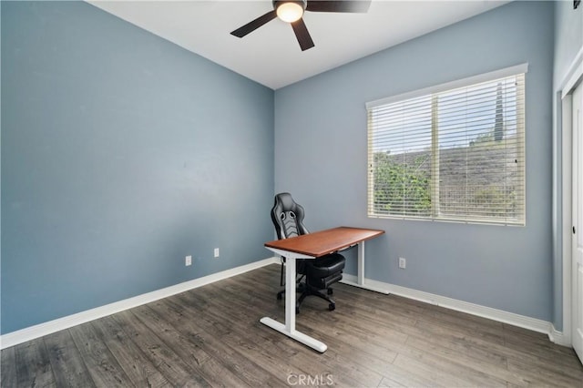 office space featuring wood finished floors, baseboards, and a ceiling fan