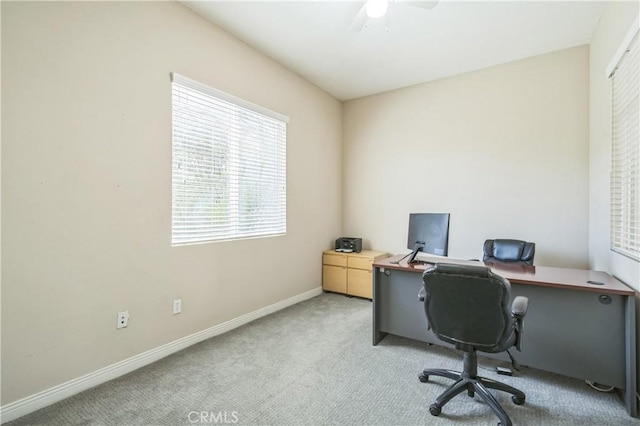 home office featuring carpet, baseboards, and ceiling fan