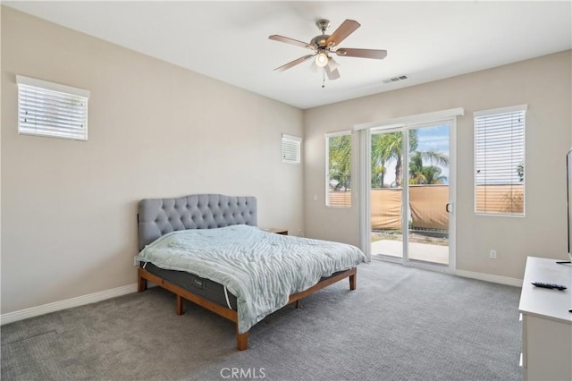 carpeted bedroom featuring access to outside, ceiling fan, baseboards, and visible vents