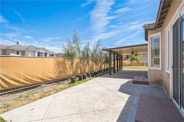 view of patio / terrace featuring a fenced backyard and ceiling fan