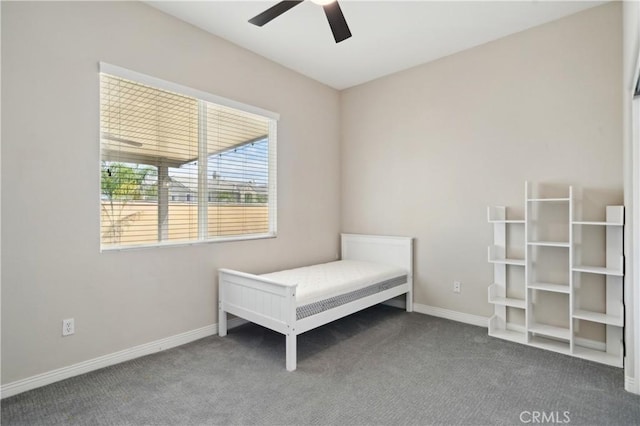 bedroom featuring ceiling fan, carpet flooring, and baseboards