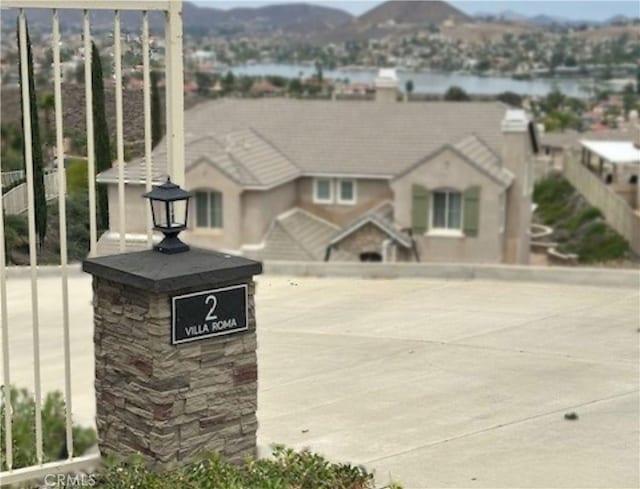 2 Villa Roma St, Lake Elsinore, CA 92532 - exterior space with a mountain view and stone siding