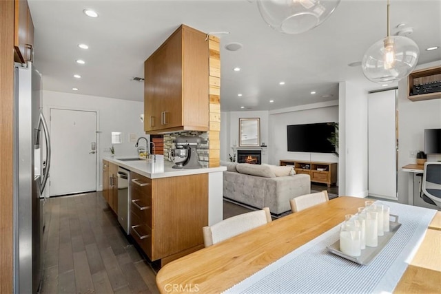 5545 Whitsett Ave Unit 1, Valley Village, CA 91607 - kitchen with dark wood-type flooring, recessed lighting, appliances with stainless steel finishes, a sink, and light countertops