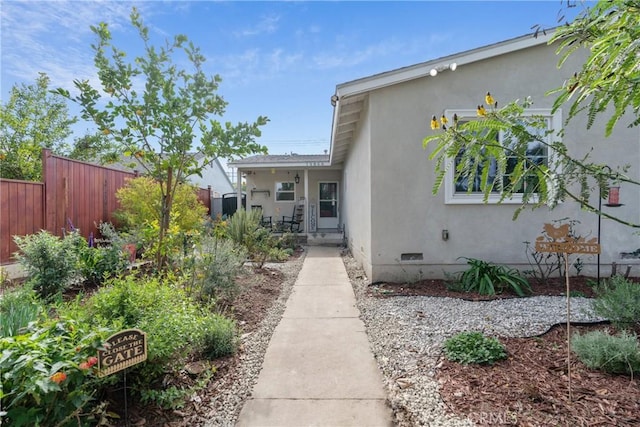 14844 Lull St, Van Nuys, CA 91405 - entrance to property featuring stucco siding, fence, and crawl space