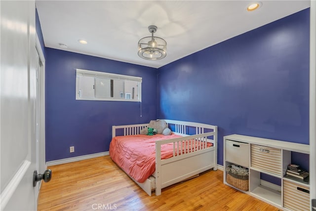 14844 Lull St, Van Nuys, CA 91405 - bedroom with wood finished floors, baseboards, and recessed lighting